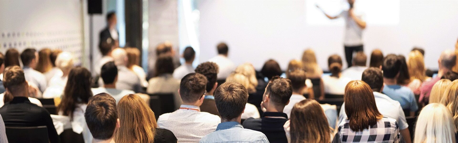 UF_Events_Webpage_Header_Image people listening at a conference